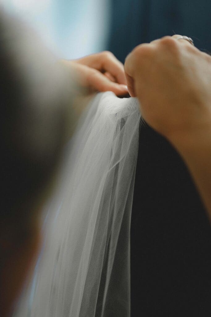Bride's veil being put in in