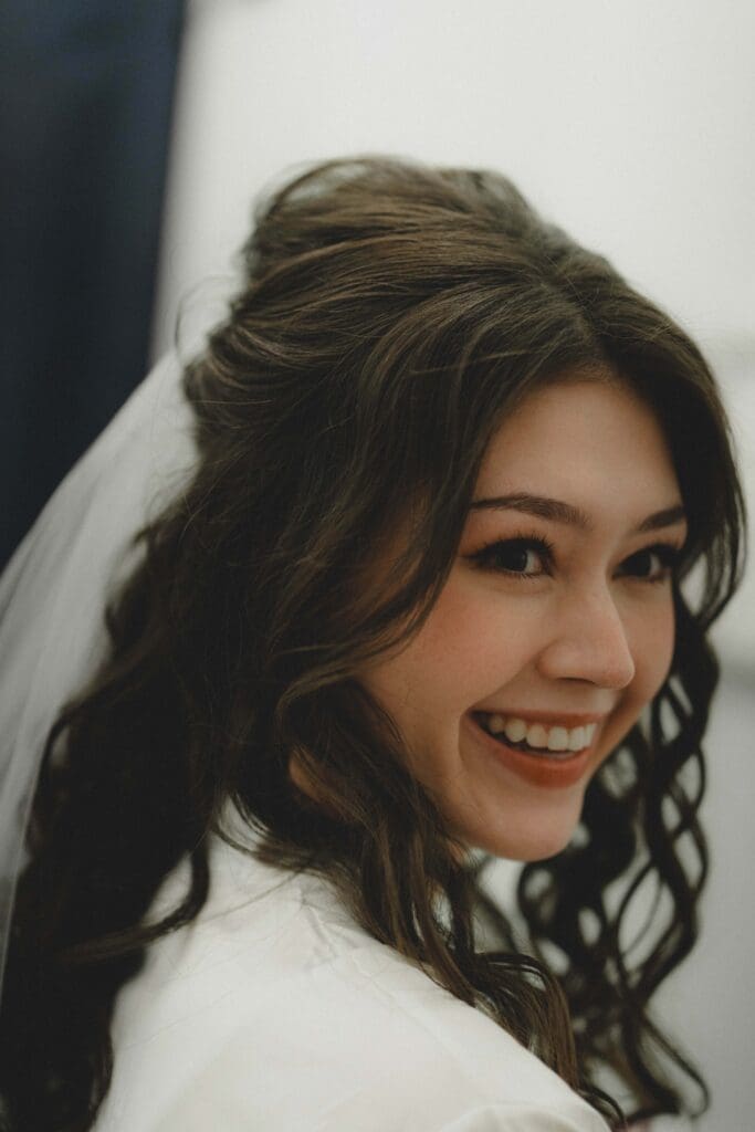 Bride laughing at the camera