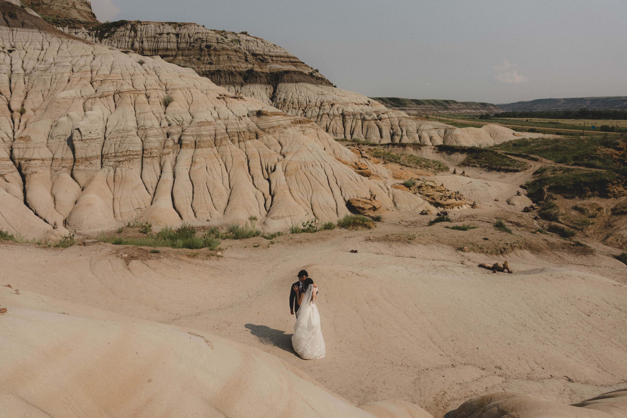 Wedding couple dancing in the Drumheller Hoodoos