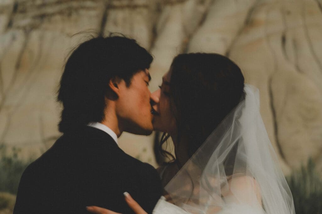 Close up of Wedding couple kissing in the Drumheller badlands