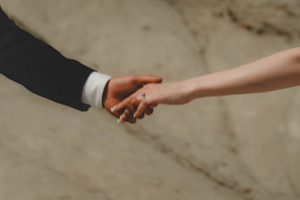 Close up of wedding couple's hands in the drumheller badlands