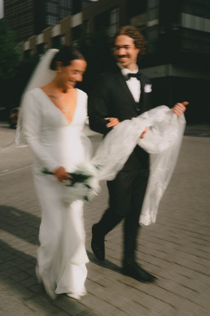Wedding couple blurred as they walk through Calgary's East Village