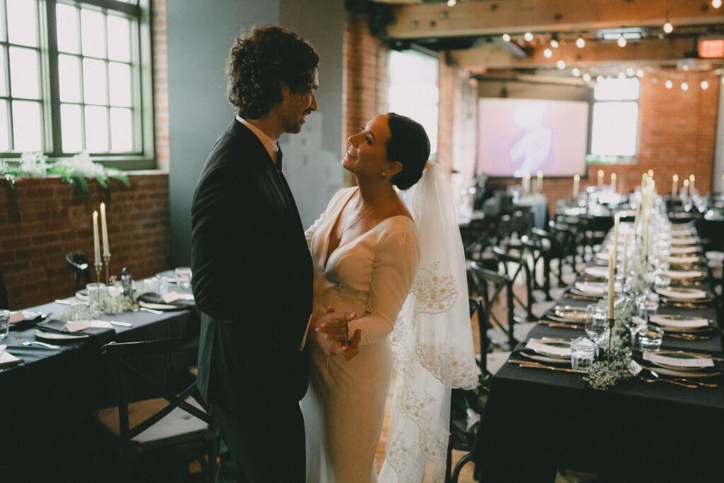 Wedding couple dancing in front of their reception setup at Charbar