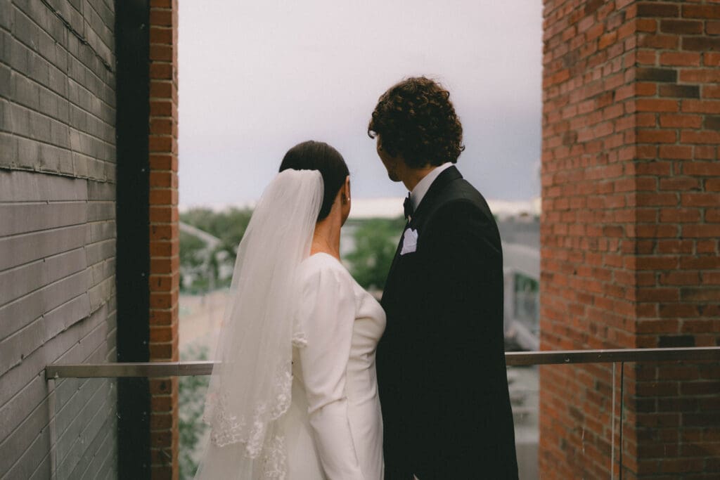 Wedding couple looking out at the horizon on Charbar's rooftop patio